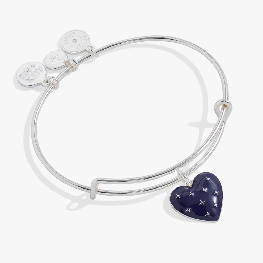 Navy enamel heart charm bangle with starburst detailing on an elegant metal band