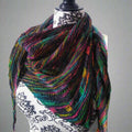 Neon Pop Shawl Knitting Pattern featuring a dark shawl with vibrant rainbow color details.
