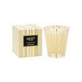 Birchwood Pine scented candle in a gold and green geometric patterned glass vessel