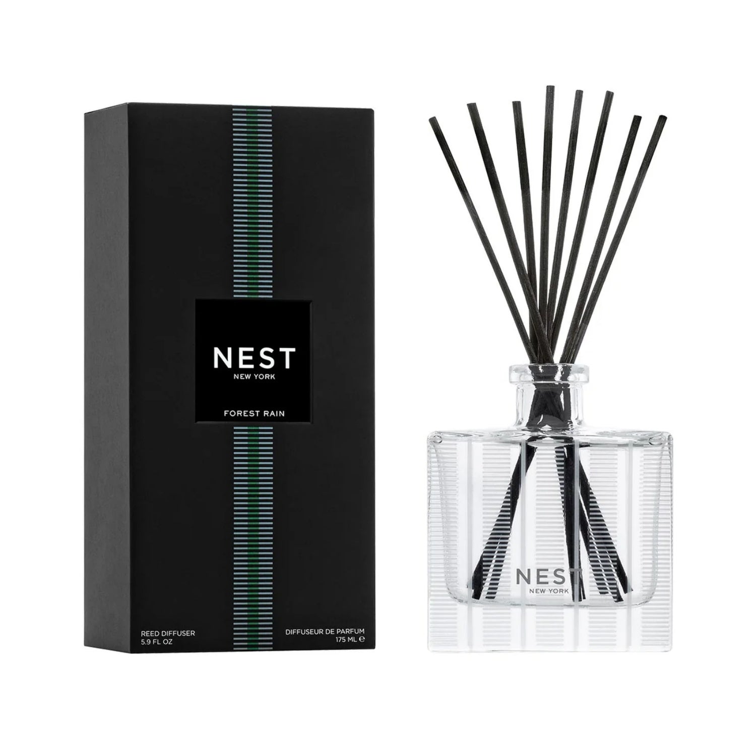 Minimalist clear glass FOREST RAIN reed diffuser with black and white packaging