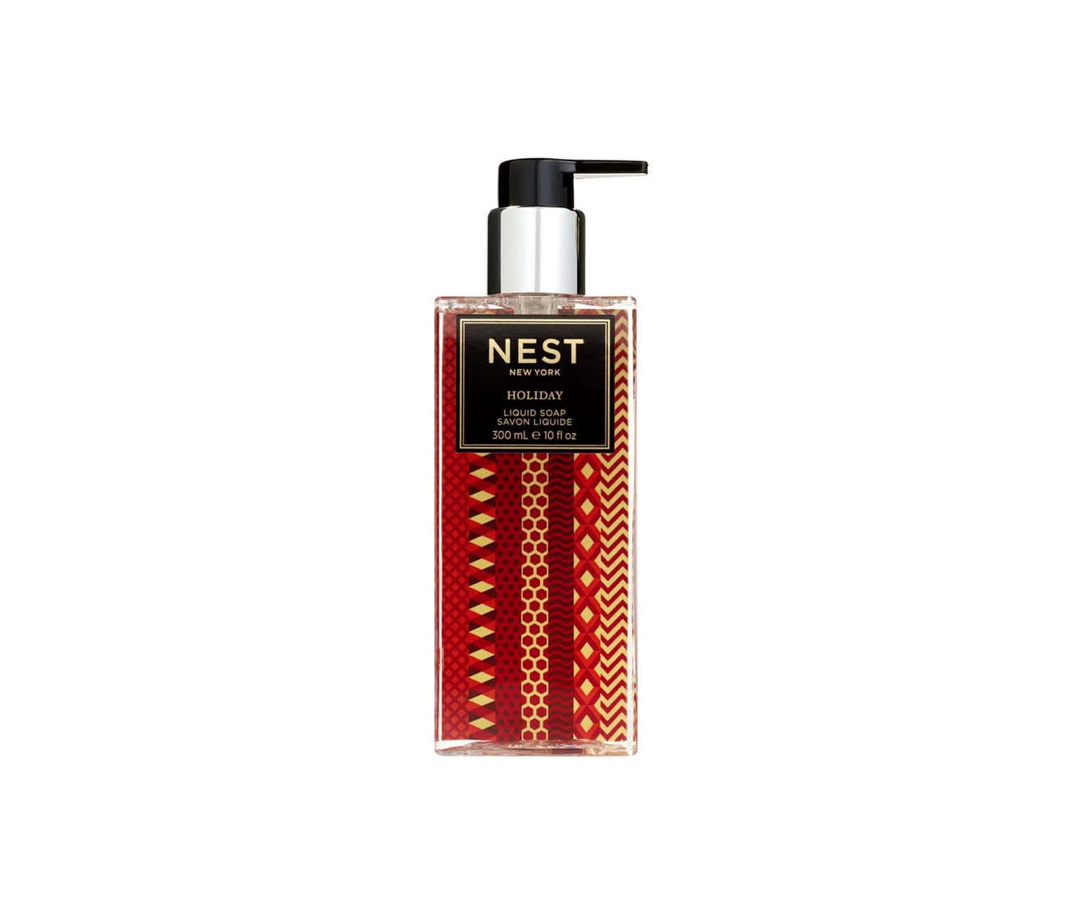 NEST New York Holiday Liquid Soap in a festive red and gold geometric bottle on a white background.