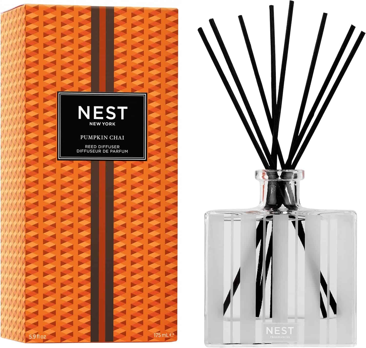 Nest New York Pumpkin Chai Reed Diffuser in a vibrant orange geometric glass bottle with black reeds.
