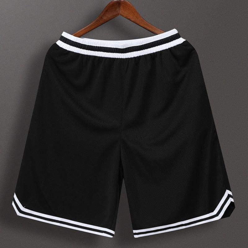 Men's loose fit patchwork basketball shorts in solid black, white, and purple for athletic and streetwear style.