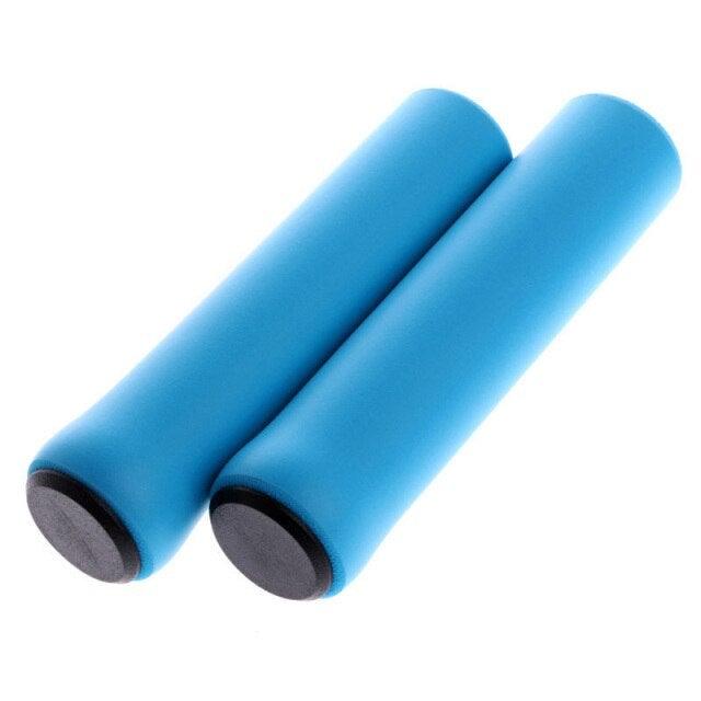 Ergonomic silicone bicycle handlebar grips with shock-absorbing texture for improved comfort.