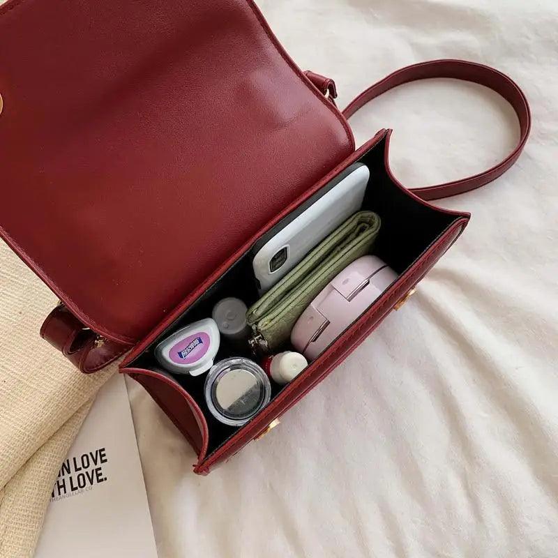 Classic Designer Shoulder Bag with Genuine Suede and Metal Accents