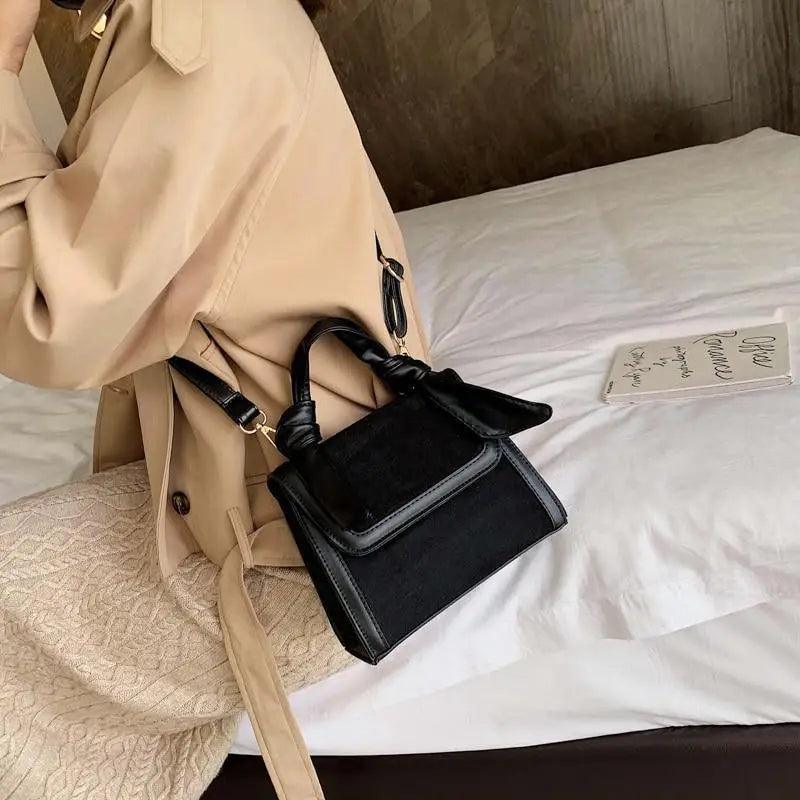 Classic Designer Shoulder Bag with Genuine Suede and Metal Accents