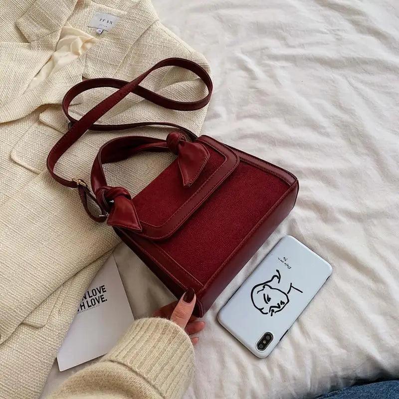 Classic Designer Shoulder Bag with Genuine Suede and Metal Accents