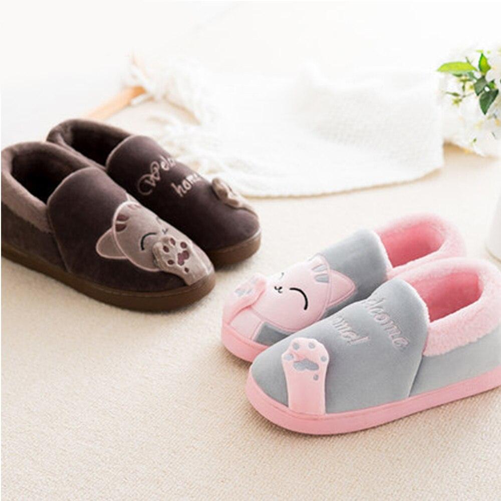 A pair of cute, fuzzy animal print indoor slippers with plush fleece lining and non-slip soles.
