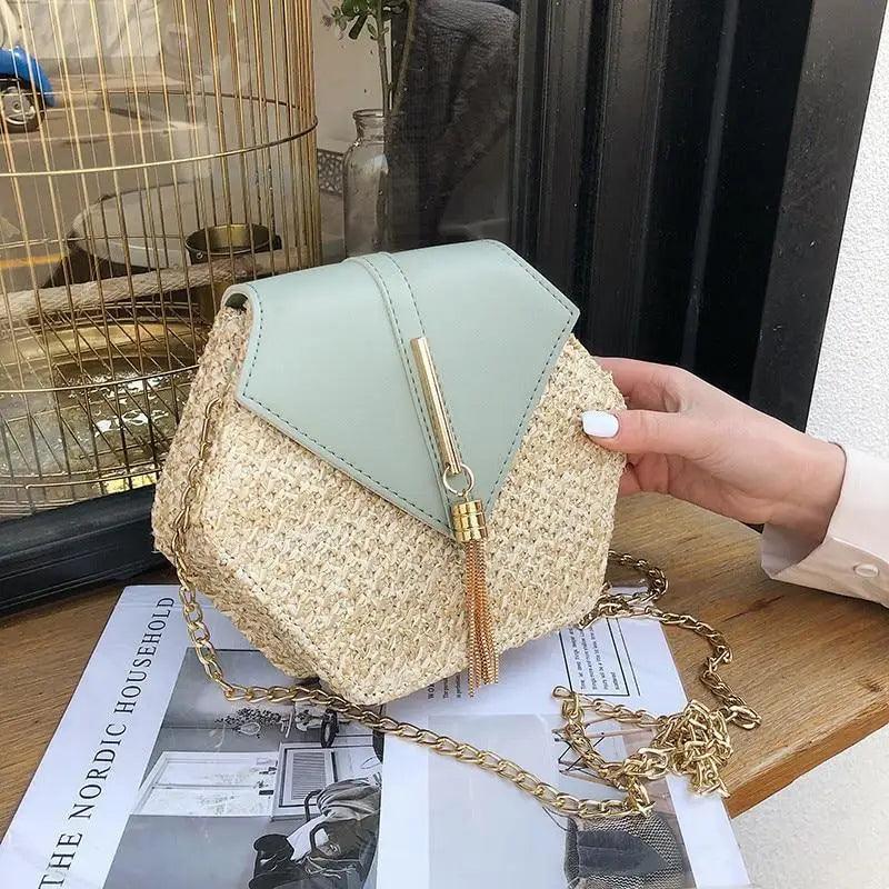 A round woven straw shoulder bag with leather accents for a bohemian summer look.