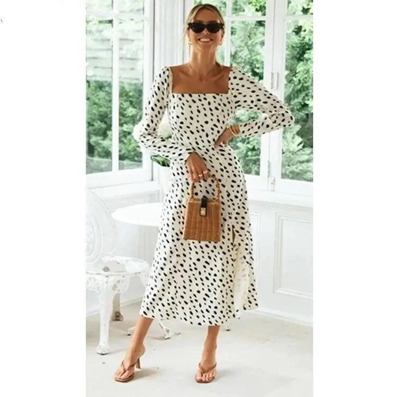White and black leopard print dress with long sleeves and leg slit