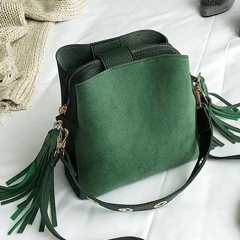 Vintage style bucket messenger bag with tassel and front pocket