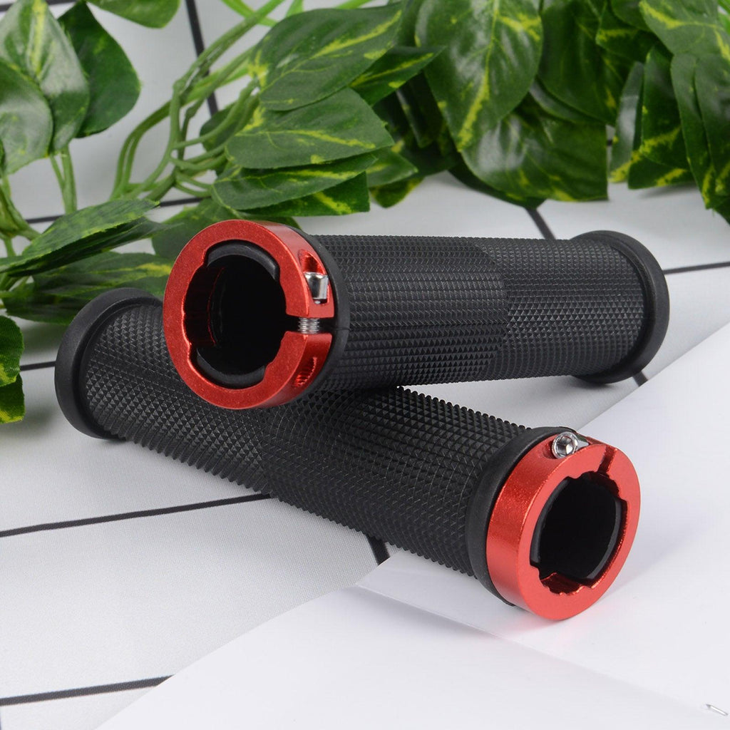 Close-up of bike handlebar grips featuring dual silver aluminum lock-on rings and textured rubber.