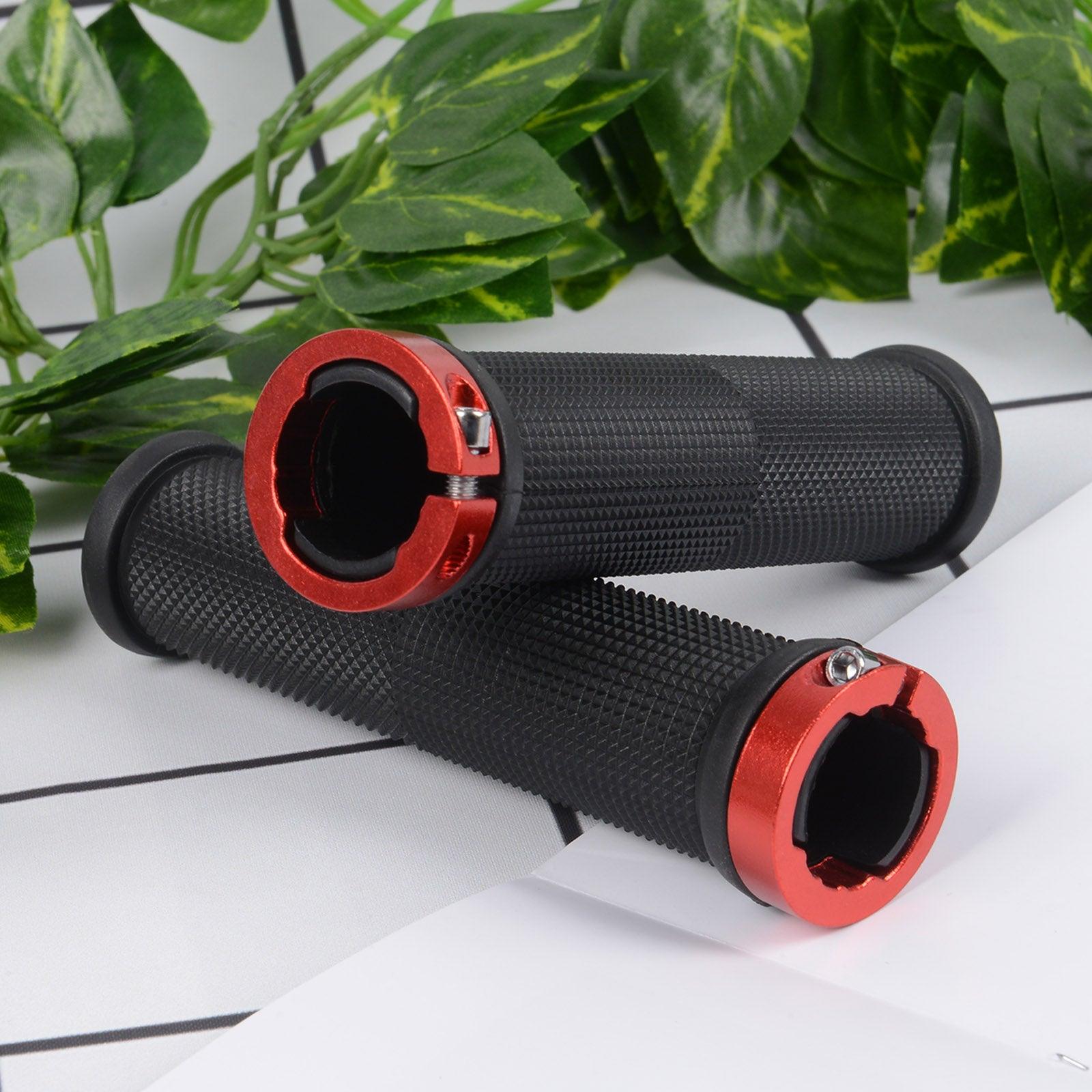 Close-up of bike handlebar grips featuring dual silver aluminum lock-on rings and textured rubber.