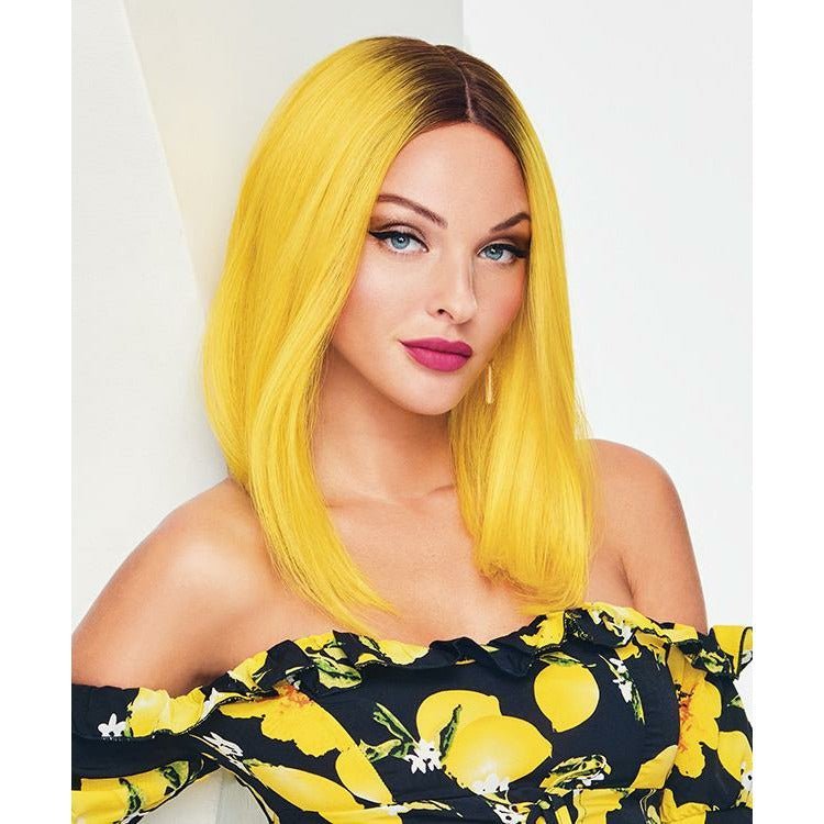 A stylish, modern wig in vibrant fantasy yellow with brown tones, styled for a bold look.