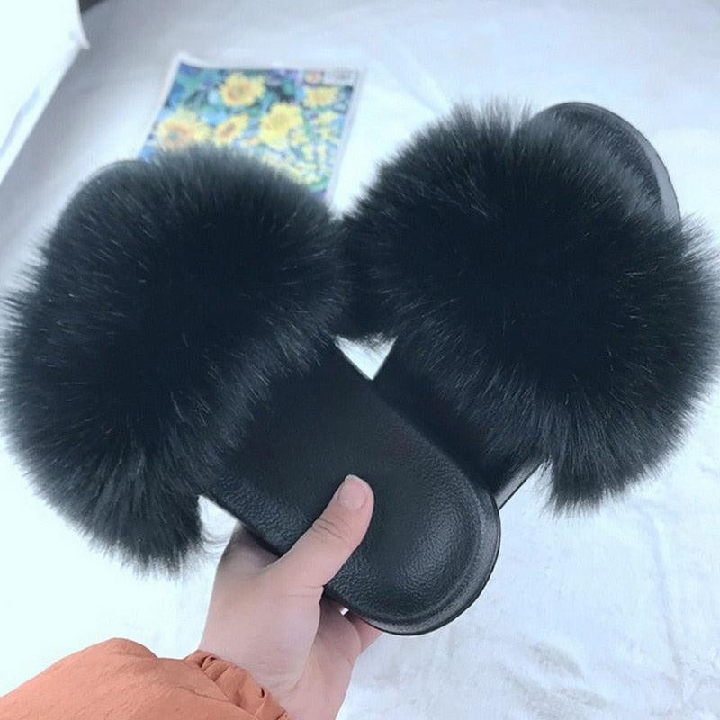 Luxury plush faux fur slippers for women featuring anti-slip rubber soles and soft fuzzy upper.