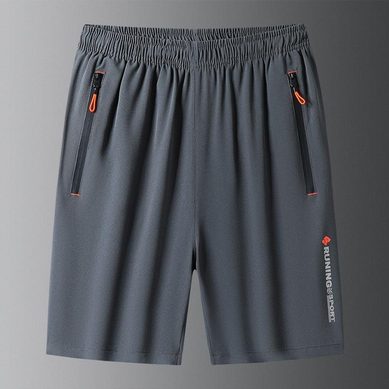 Men wearing grey ice silk quick-dry athletic running shorts in a gym setting