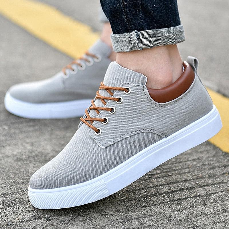 Men's casual breathable canvas sneakers in grey, black, and red solid colors