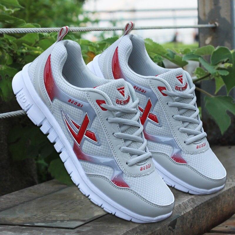 Mens lightweight breathable flying woven mesh walking sneakers in a slip-on athletic style.
