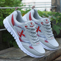 Mens lightweight breathable flying woven mesh walking sneakers in a slip-on athletic style.