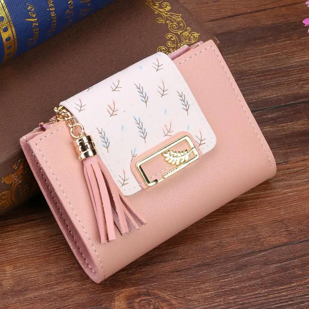 Minimalist women's pastel pink and cream leather short clutch wallet with snap closure