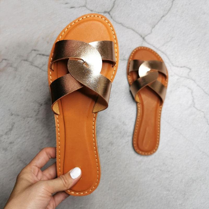 Minimalist women's leather two-strap slide sandals in metallic brown