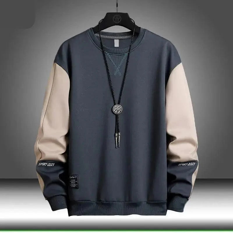 Men wearing a loose-fit patchwork streetwear pullover hoodie in a casual setting