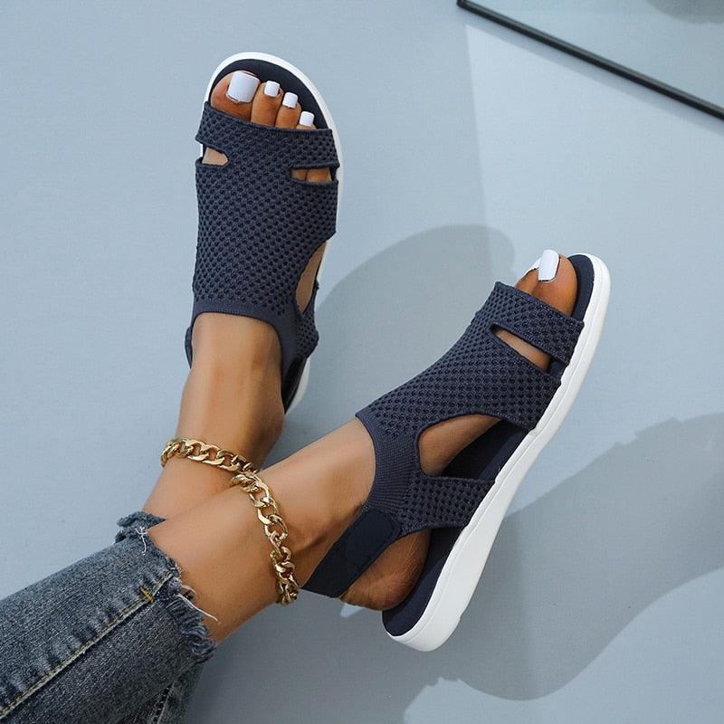 Blue square toe flat sandals with buckle strap and slip-on design