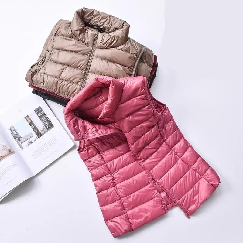 Women wearing a lightweight red high-collar duck down vest in a minimalist style.