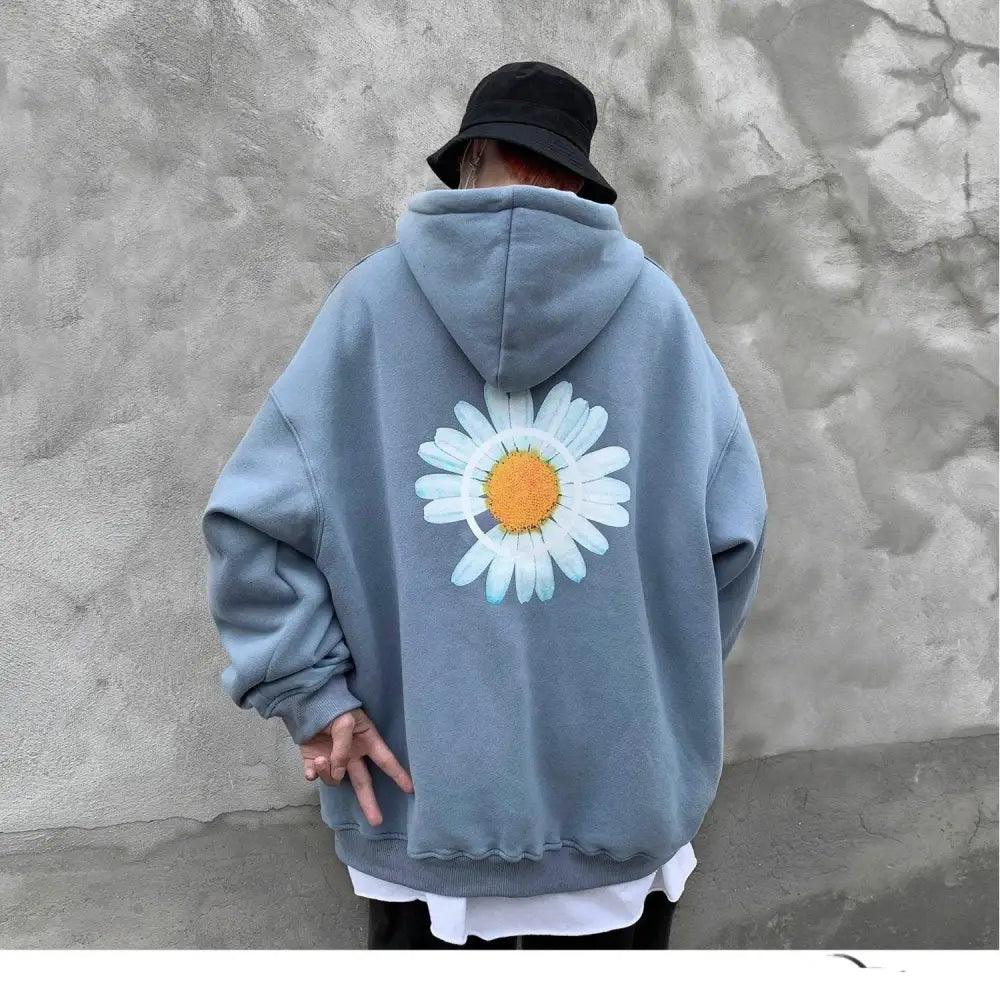 Oversized winter hooded sweatshirt featuring a vibrant sunflower print and adjustable drawstring