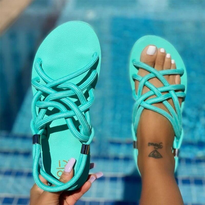 Women wearing casual summer linen platform slides with a striped bow in bright colors