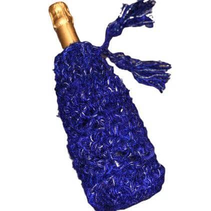 Sparkly handmade crochet bottle cover on a wine bottle for New Year's Eve