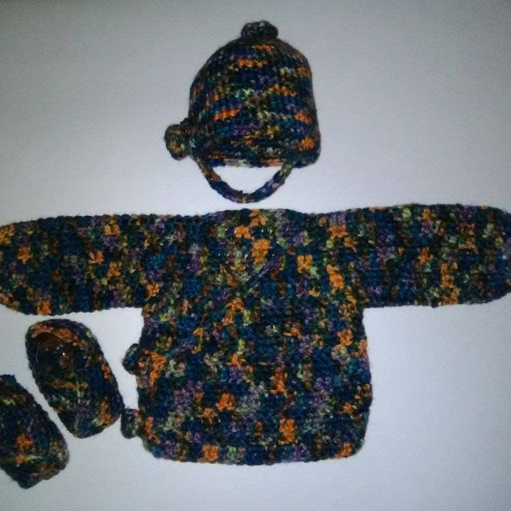 Vintage-style crochet newborn duster cardigan in a multicolor variegated yarn