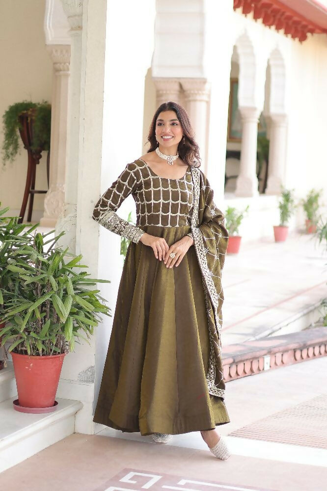Vibrant mehndi silk kurta set with ornate sequins, zari, and thread embroidery.