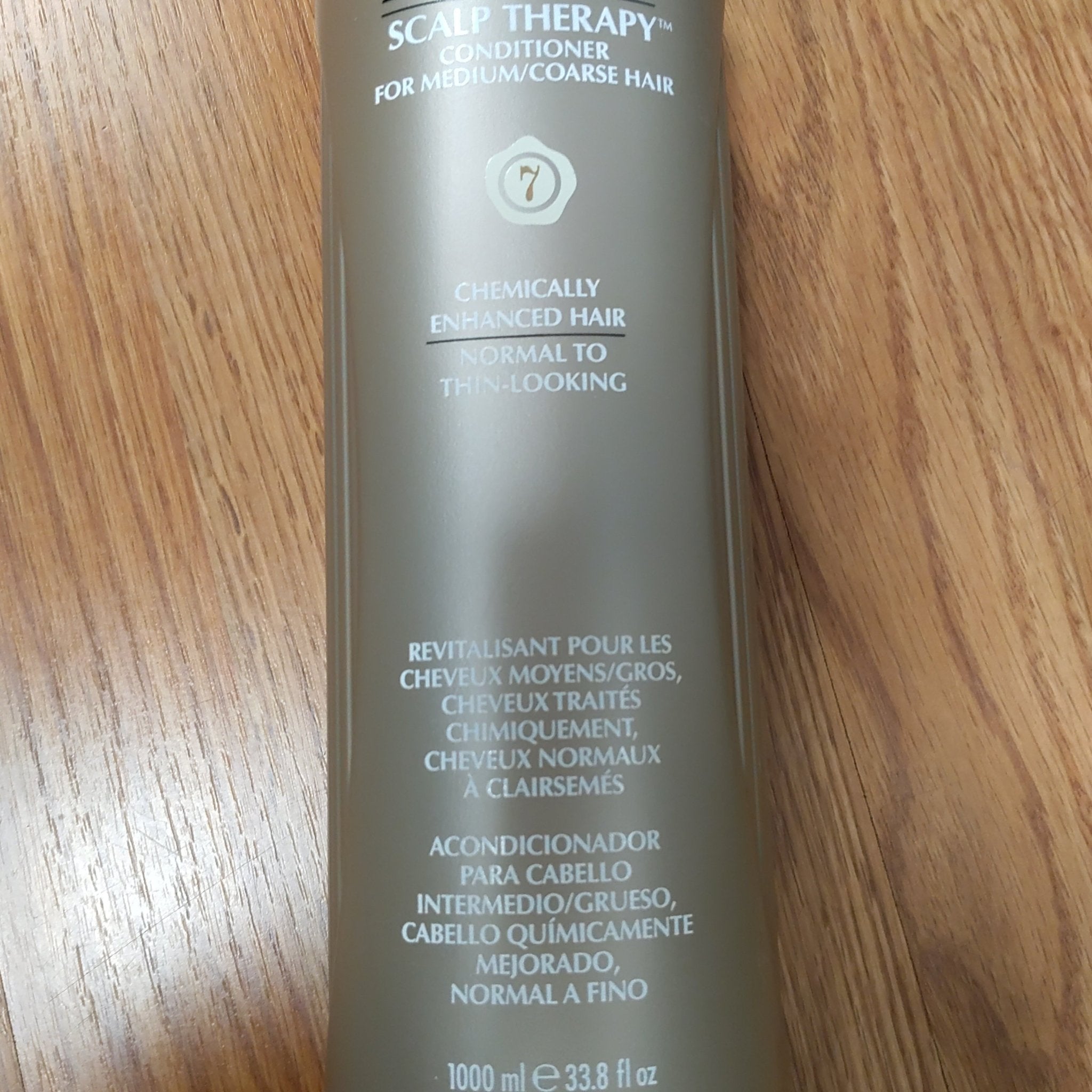 A 33.8 oz bottle of Nioxin System 7 Scalp Therapy Conditioner for medium to coarse, thinning hair.