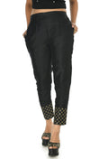 A pair of sleek black ankle-length silk pants with a slip-on design.