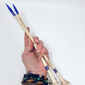 Set of 12-inch maple wood knitting needles with purple glitter resin accents at the ends