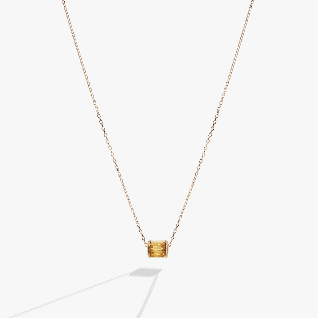 Sliding barrel November birthstone pendant with golden baguette crystals in gold and silver
