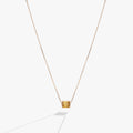 Sliding barrel November birthstone pendant with golden baguette crystals in gold and silver