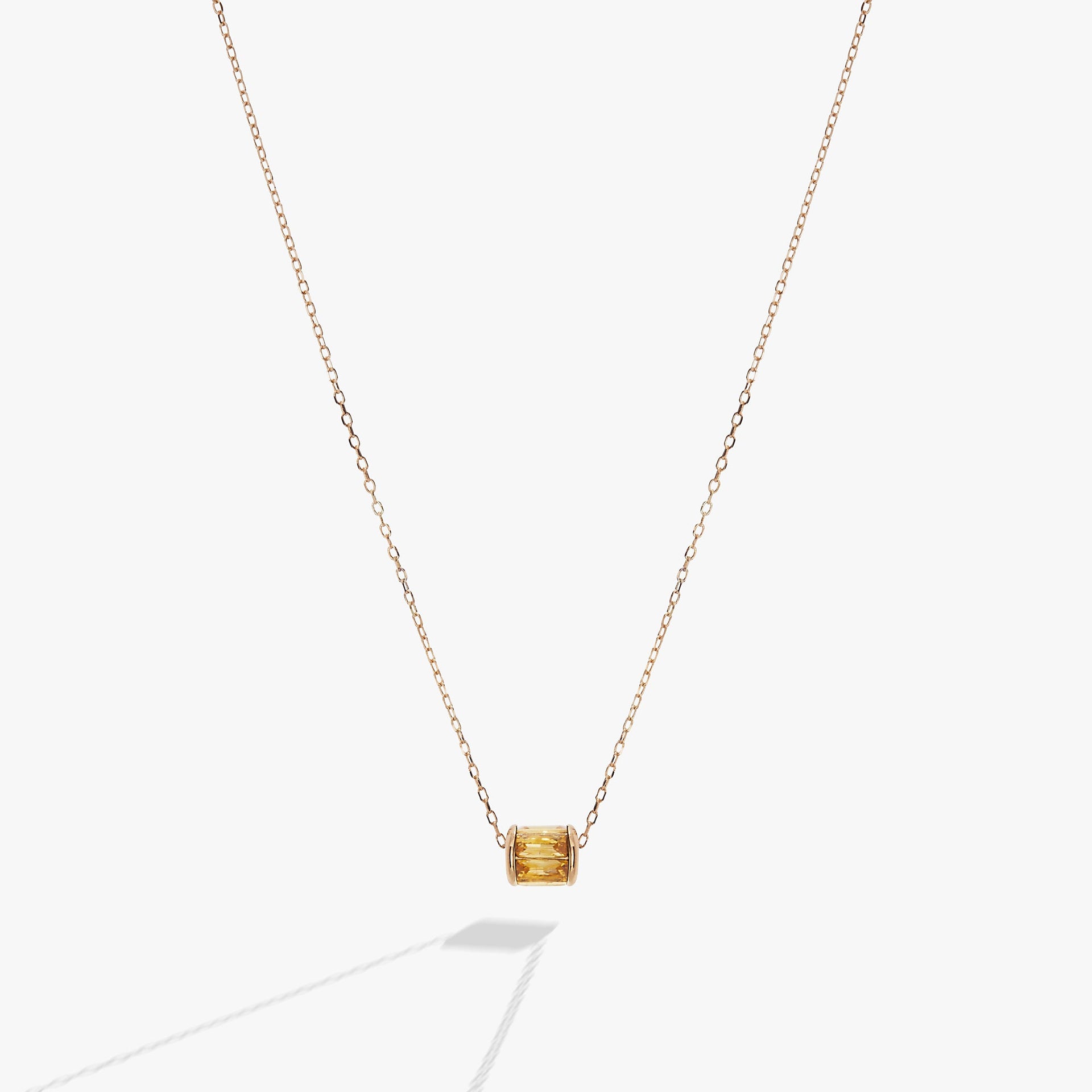 Sliding barrel November birthstone pendant with golden baguette crystals in gold and silver
