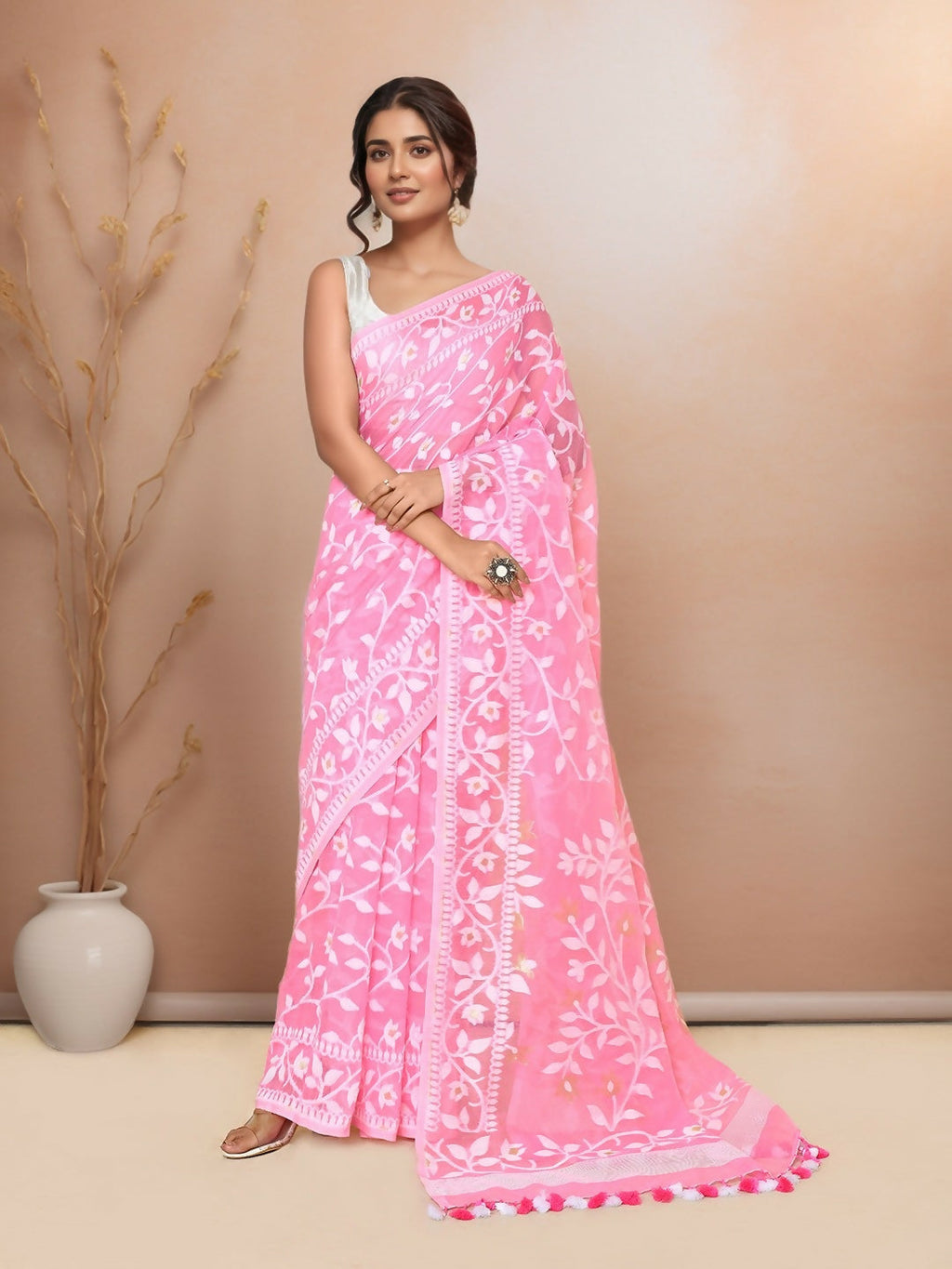 Beautiful light pink cotton blend Jamdani saree with traditional intricate weaving patterns