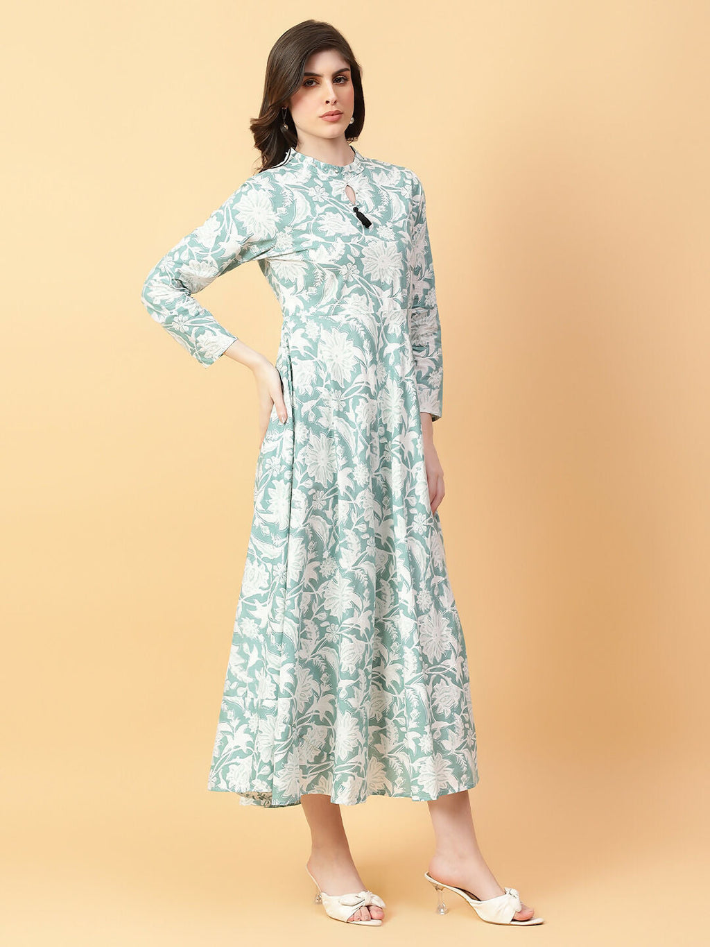 Stylish green cotton midi dress with intricate hand work and classic print.
