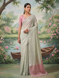 Stunning silver tissue silk saree reflecting a metallic luster.