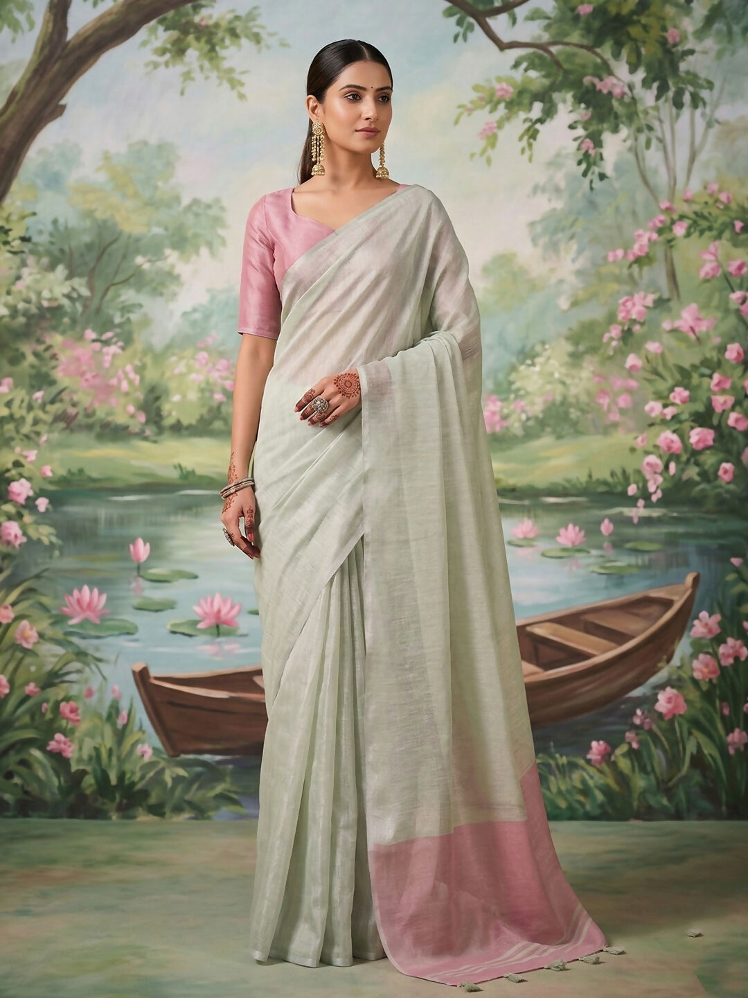 Stunning silver tissue silk saree reflecting a metallic luster.