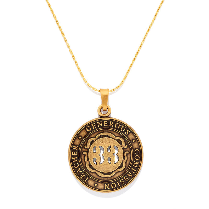Number 33 medallion necklace in brushed vintage gold tone on a minimalist cable chain.
