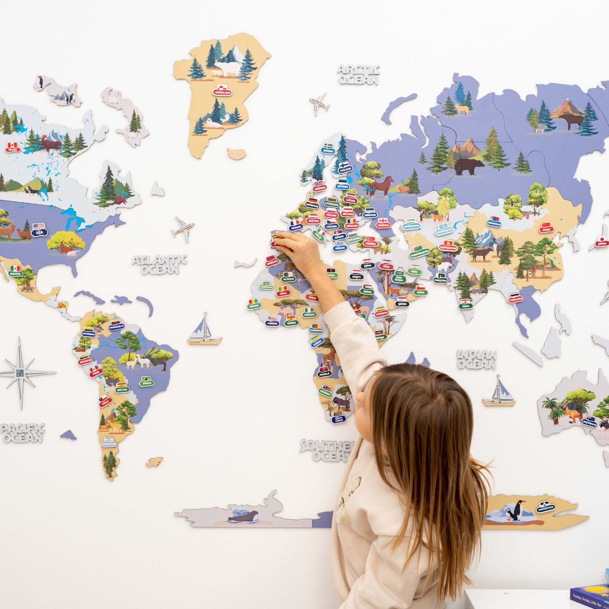 Indigo nursery world map with cute animal illustrations for kids room