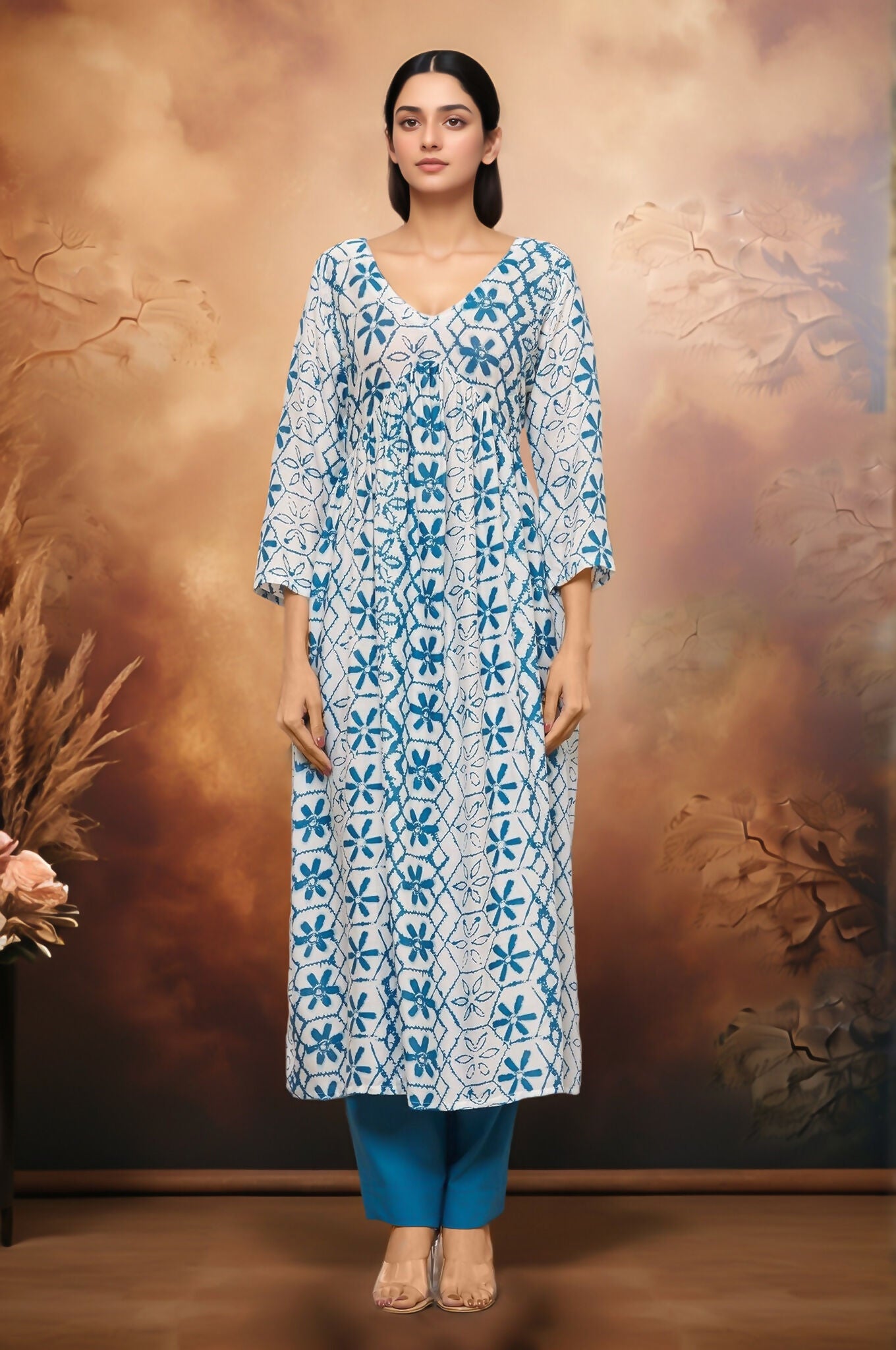 White and blue geometric floral print kurti paired with matching palazzo pants