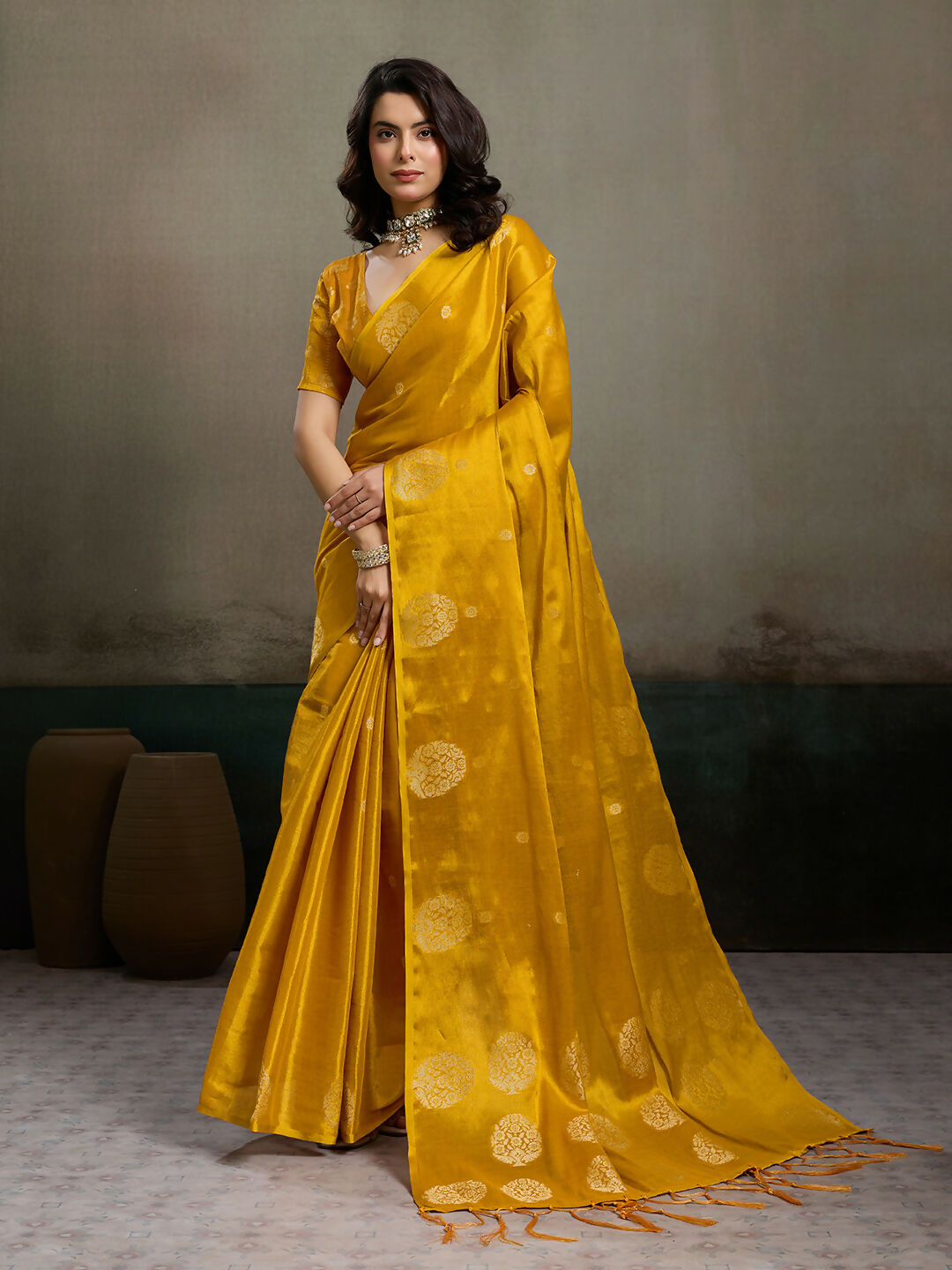 Mustard yellow tissue silk saree with elegant metallic sheen