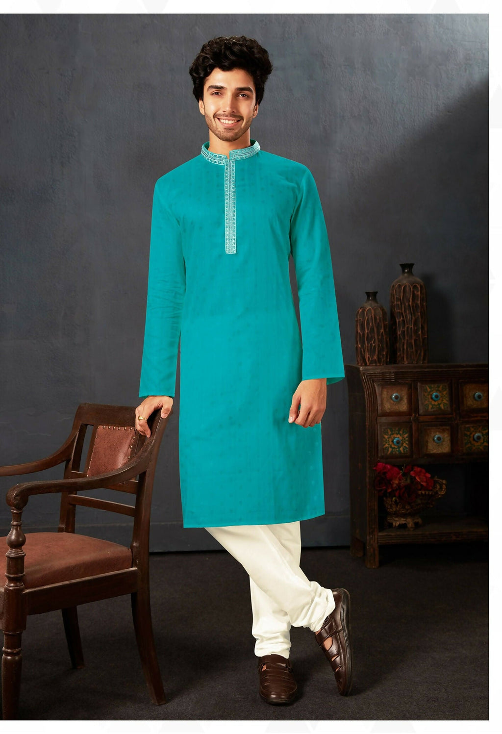 Baby boy wearing a firozi cotton kurta with off-white art silk pyjamas for a festive occasion.