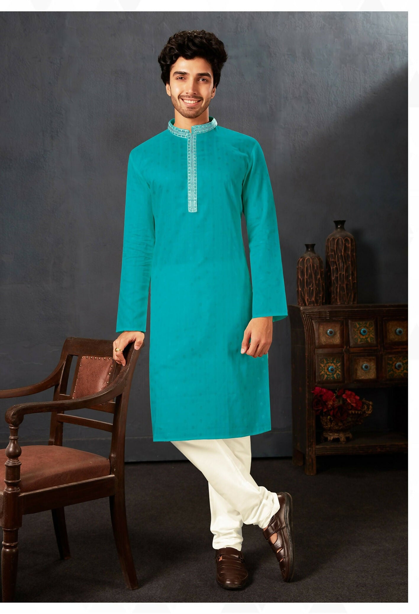 Baby boy wearing a firozi cotton kurta with off-white art silk pyjamas for a festive occasion.