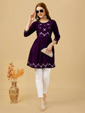 Women wearing a purple viscose rayon top with intricate embroidery and sequence detailing
